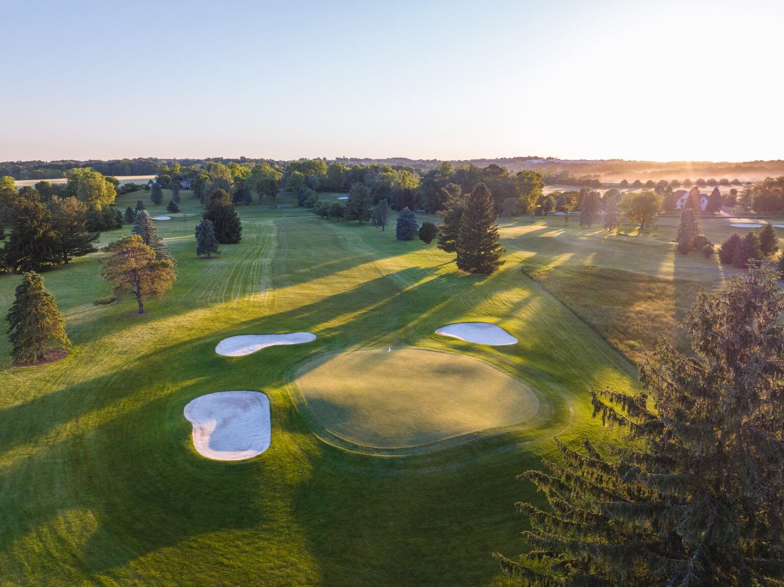 Sun spilling down the fairway