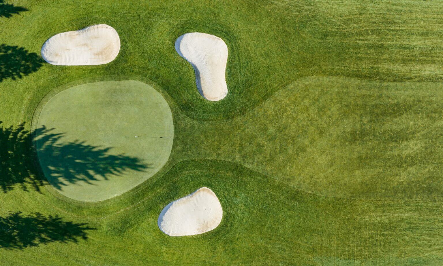 Three bunkers and the putting surface