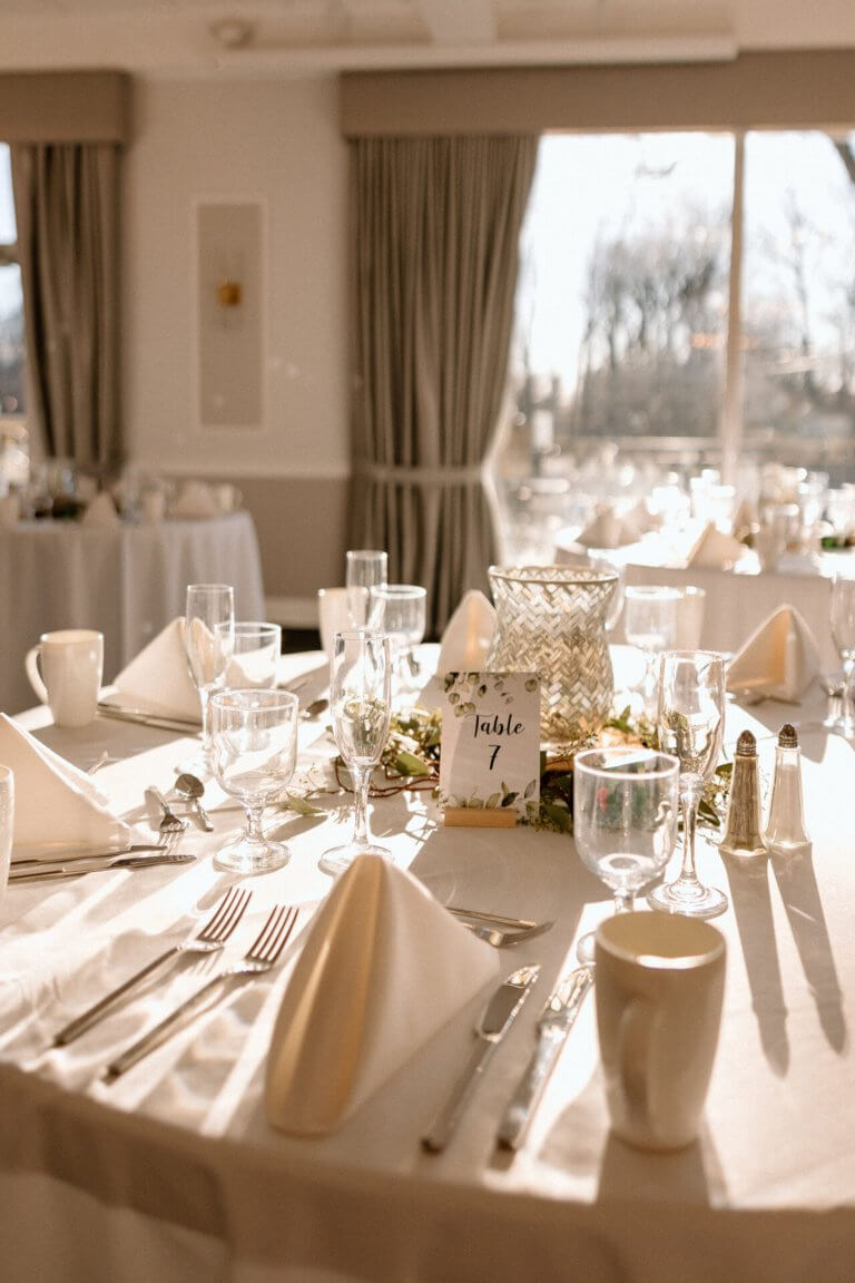 Table seven, white linens and soft daylight
