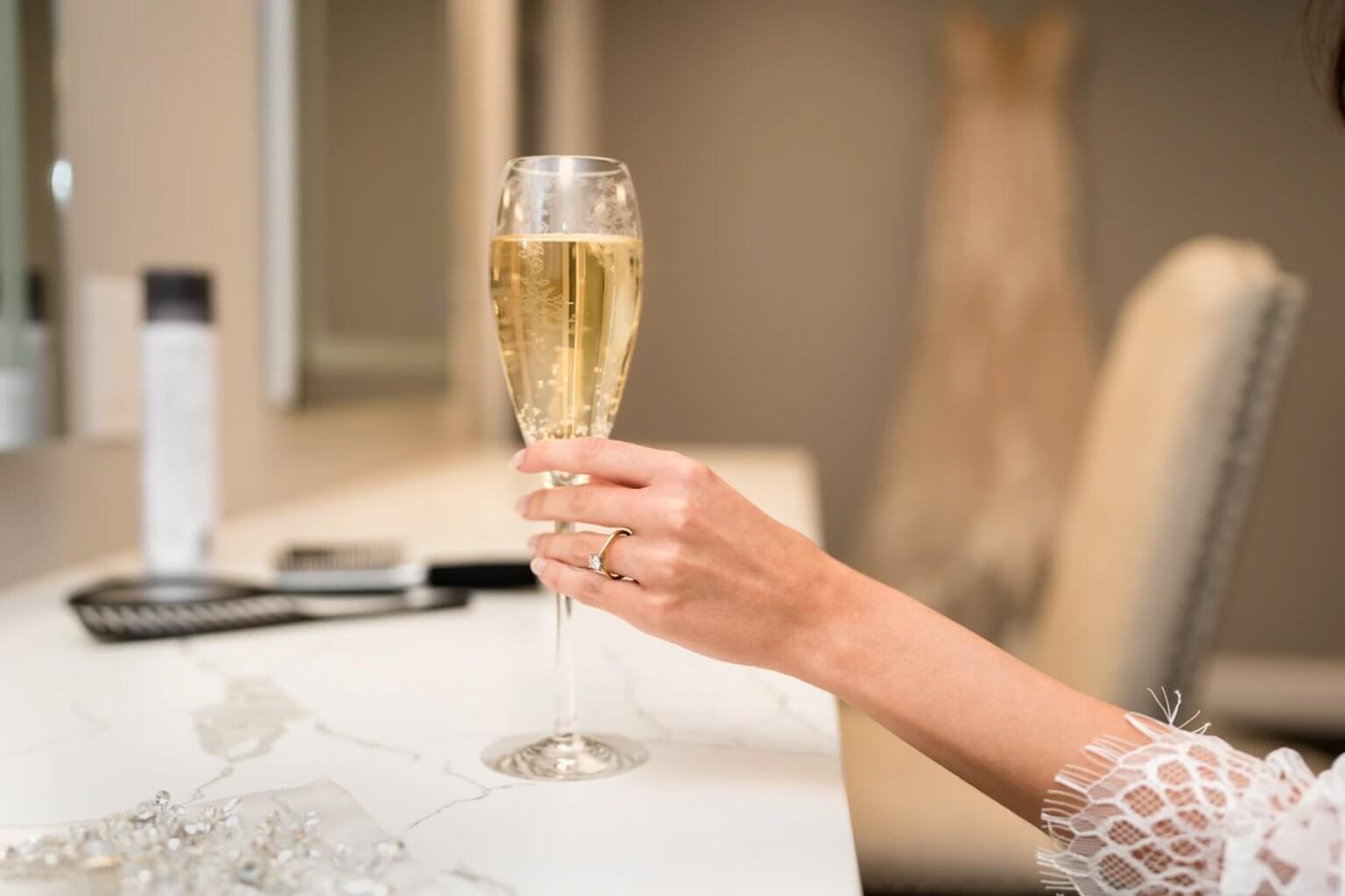 A flute and the ring before the dress goes on