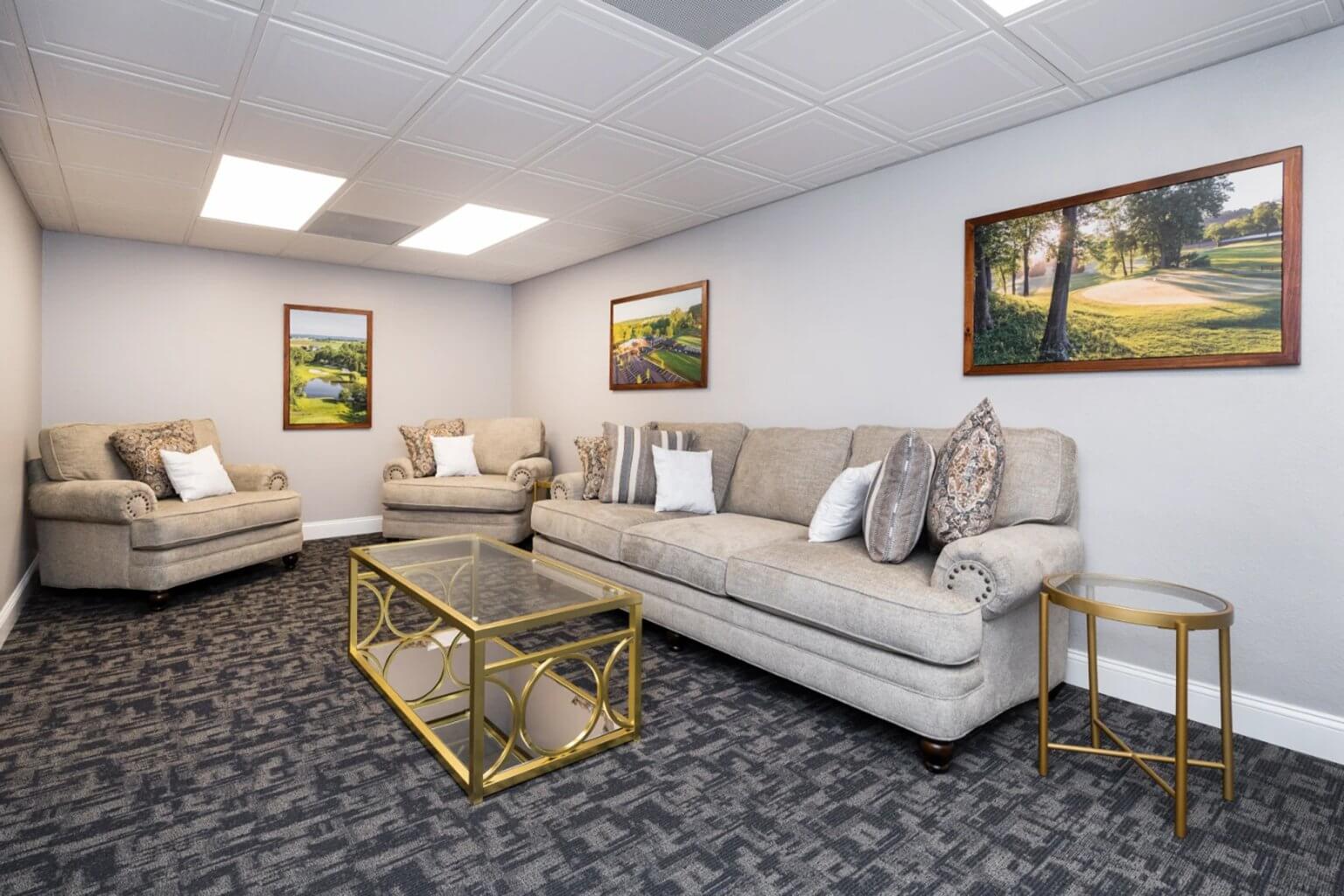 Sofa, chairs and gold glass tables